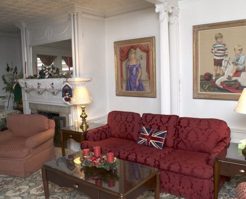 Couch and fireplace seating in a Victoria Home common room
